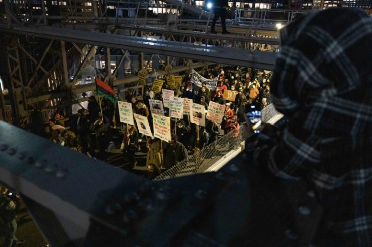 Demonstrators marched on the Brooklyn Bridge in New York during a protest against the Kyle Rittenhouse verdict