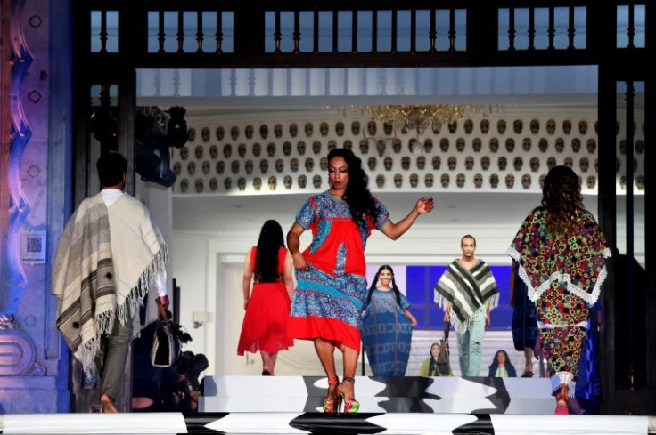 Models present indigenous creations at a fashion fair in Mexico City aimed at tackling alleged cultural appropriation by foreign designers
