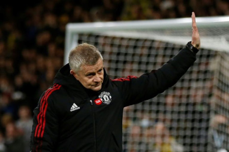 Is this goodbye? Ole Gunnar Solskjaer waves to Manchester United supporters after the 4-1 defeat at Watford on Saturday. The fans reacted by booing the manager