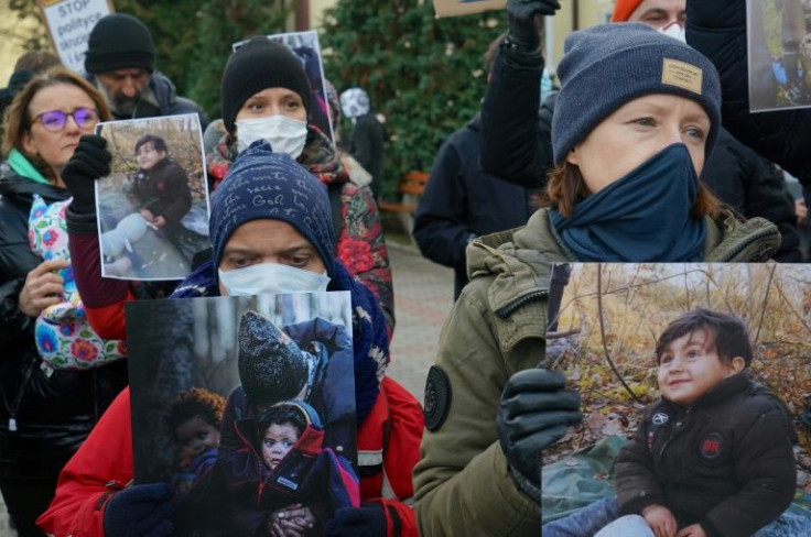 People protest with photos of children to draw attention to the humanitarian situation on the Polish-Belarusian border