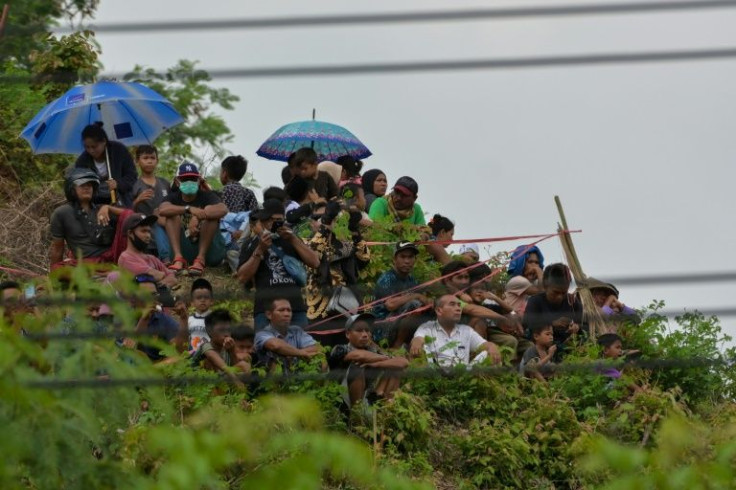For most locals, tickets to the motorbike races are too expensive and many have to settle for watching from a hill overlooking the circuit