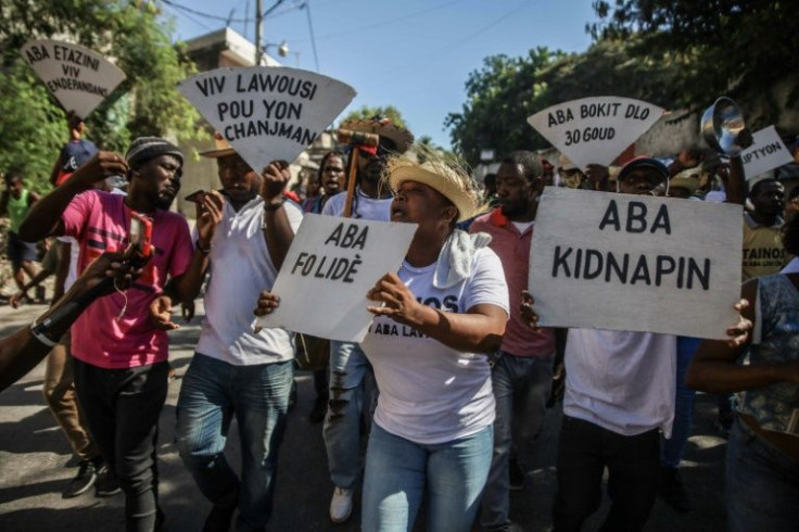 People protest against Haiti's spike in kidnappings and a gang-aggravated fuel crisis in Port-au-Prince on November 18, 2021