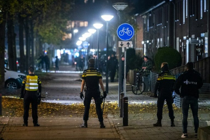Police officers patrol on the street during riots against the partial lockdown and the 2G government policy at the De Kemp district in Roermond, on November 20, 2021. Fresh rioting broke out late November 20, 2021 over the Dutch government's coronavirus m