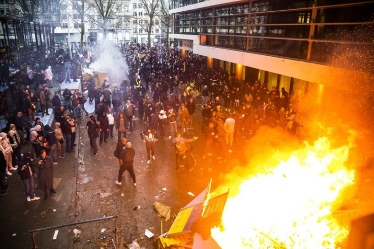 Belgian demonstrators against Covid restrictions set fire to street furniture in Brussels