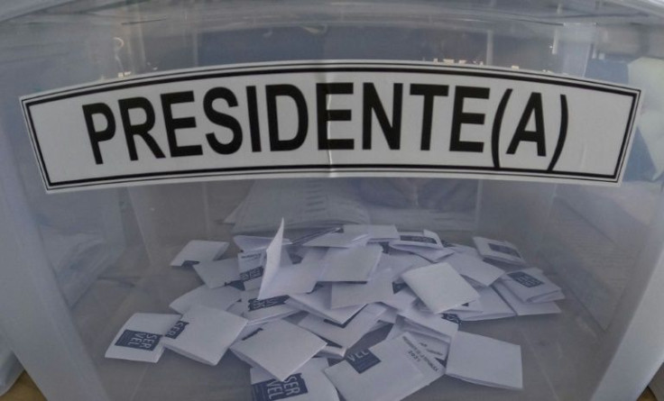 If no candidate wins 50 percent of votes outright, a runoff between the top two contenders will be held on December 19