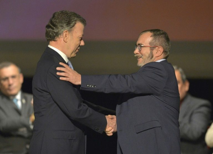 Then Colombian president Juan Manuel Santos (L), and FARC chief Rodrigo Londono, alias Timochenko signed a peace pact on November 24, 2016