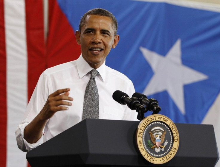 U.S. President Barack Obama speaks inside hanger at Luis Munoz Marin International Airport in Puerto Rico