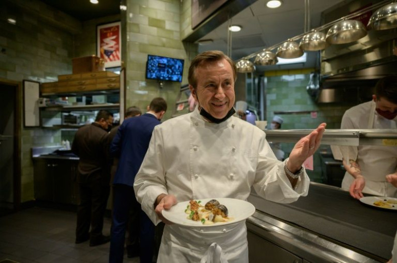 French chef and restaurateur Daniel Boulud works in the kitchen of his restaurant "Daniel," in Manhattan, New York