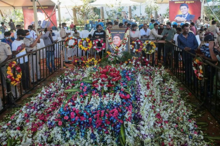 Fans mourn at the grave of Puneeth Rajkumar, who had established himself as one of the most recognisable stars of the Kannada-language film industry