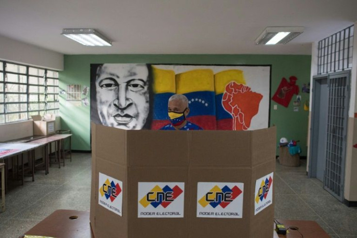 A citizen casts his vote during regional elections in Venezuela that ended in a resounding victory for the governing party