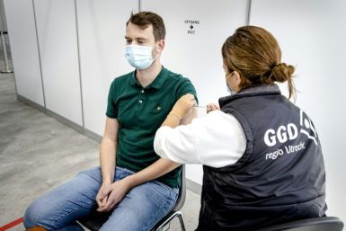 A health worker gives a Covid-19 vaccine shot in Utrecht
