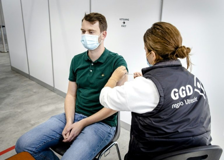 A health worker gives a Covid-19 vaccine shot in Utrecht