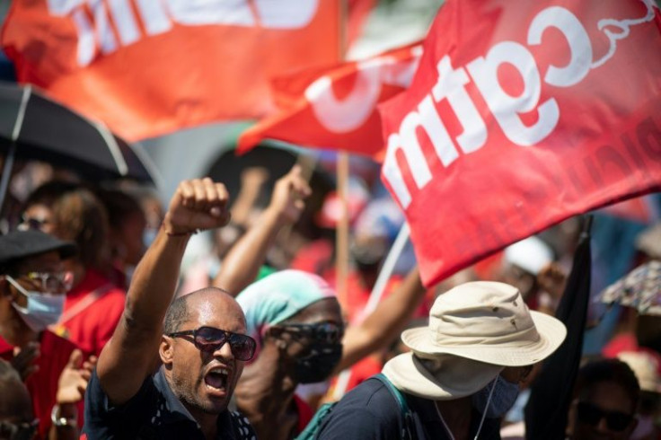 Protests against new Covid restrictions have spread to the French overseas territories of Guadaloupe and Martinique