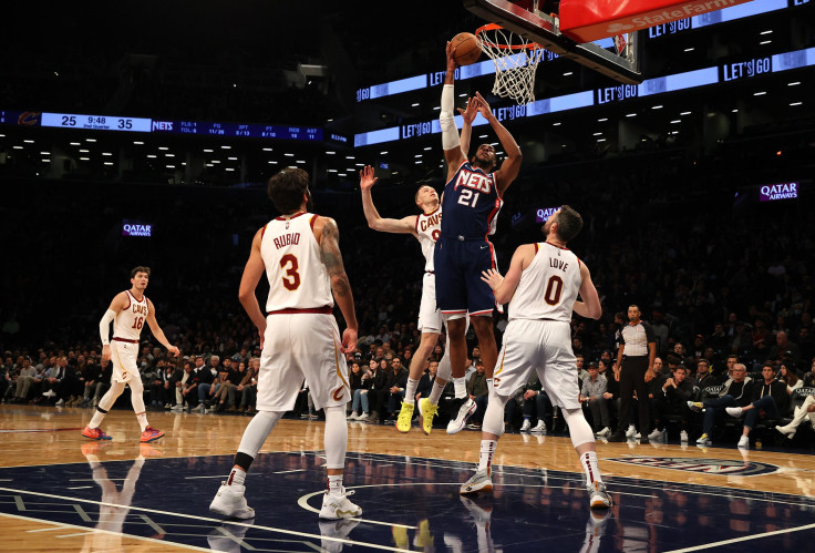 LaMarcus Aldridge #21 of the Brooklyn Nets scores against Kevin Love #0 of the Cleveland Cavaliers 