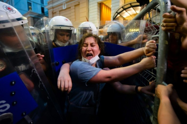 Women clash with police at a July protest against Turkey's withdrawal from the Istanbul convention