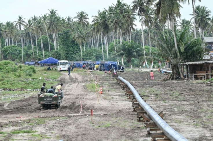 A gas pipeline is laid in Jacqueville, Ivory Coast, where locals say they have received no benefit from fossil fuel exploitation