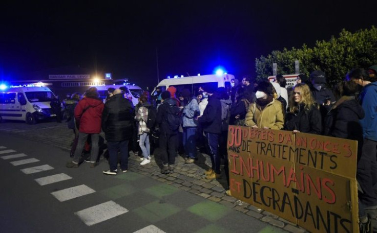 Migrant support groups held rallies calling for the end of 'degrading' treatment