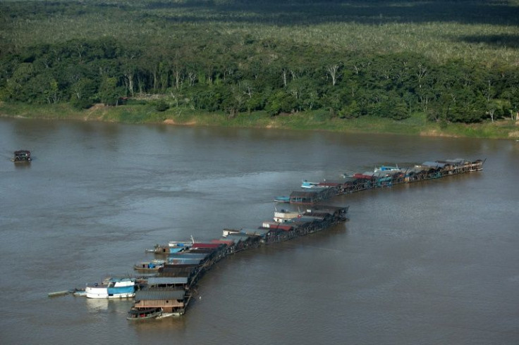 Images provided by Greenpeace show lines of boats arranged side by side across the Madeira, following rumors that gold was discovered in the nearby area around the community of Rosarinho, in Brazil's northwest