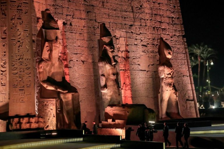 President Sisi walks with Tourism and Antiquities Minister Khaled el-Enany as they enter the pylon at the entrance of the Temple of Luxor