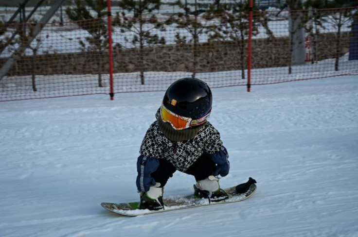 Wang Yuji is 11 months old but already able to snowboard