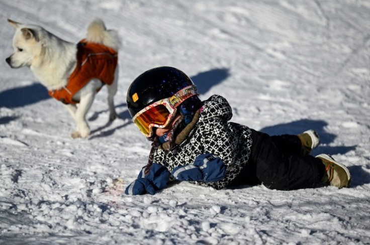 Yuji's first attempt at snowboarding was several weeks before during a family holiday