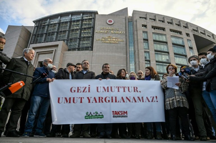 Supporters of jailed civil society leader Osman Kavala rally outside the court as the trial resumes