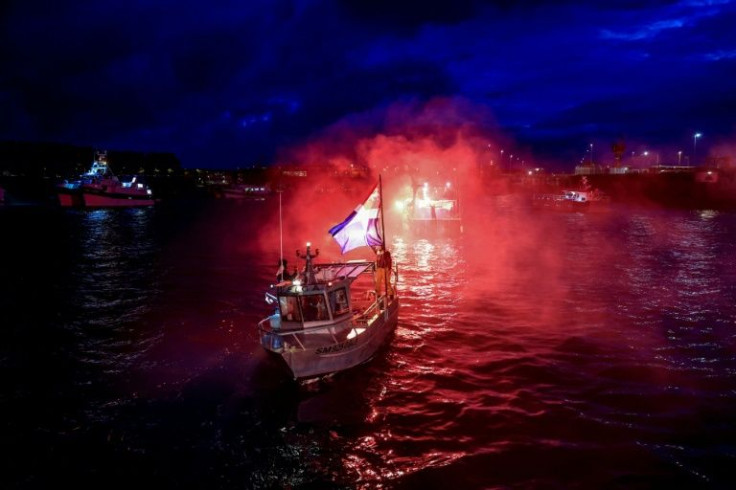 French fishing boats blocked the entrance to the port of Saint-Malo in protest at the post-Brexit fishing rights granted by Britain, but ferry service was cancelled due to bad weather