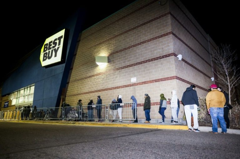"Black Friday" shoppers wait in line for a Best Buy store to open on November 26, 2021 in Westminster, Colorado