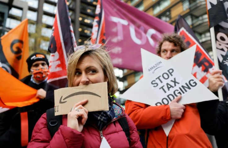 Activists from the Extinction Rebellion group protest outside of Amazon's headquarters in central London on Friday