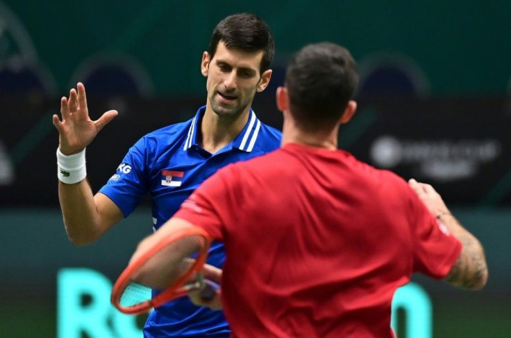 Novak Djokovic (left)) downed Austria's Dennis Novak