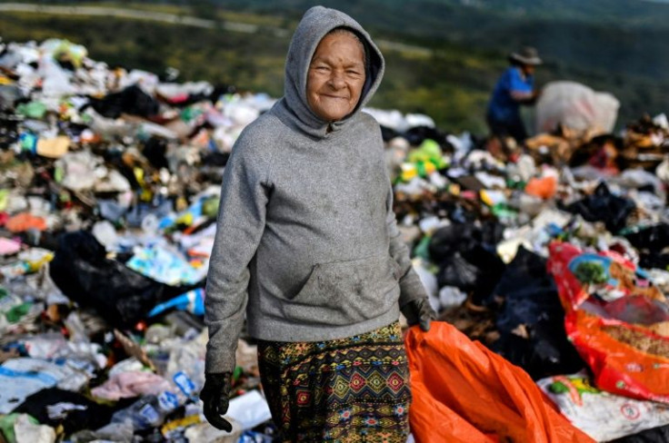 Magdalena Cerritos, 72, and her four children all work at the municipal dump close to Honduras's capital, but she holds no grudges against the governing party