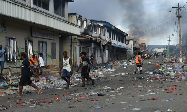 After days of unrest, large areas of the Solomon Islands' capital have been left with the scorched-black shells of buildings
