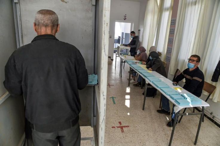 A voter casts his ballot at a polling station in Algiers