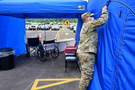 A National Guardsman erects a tent for Covid patients outside a hospital in Kentucky last month. The WHO is hoping that member states will come up with methods to prepare for the next pandemic, warning that 'the question is not if, but when'
