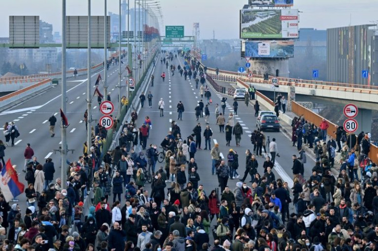 Hundreds of environmental demonstrators block a main highway in Belgrade on Saturday
