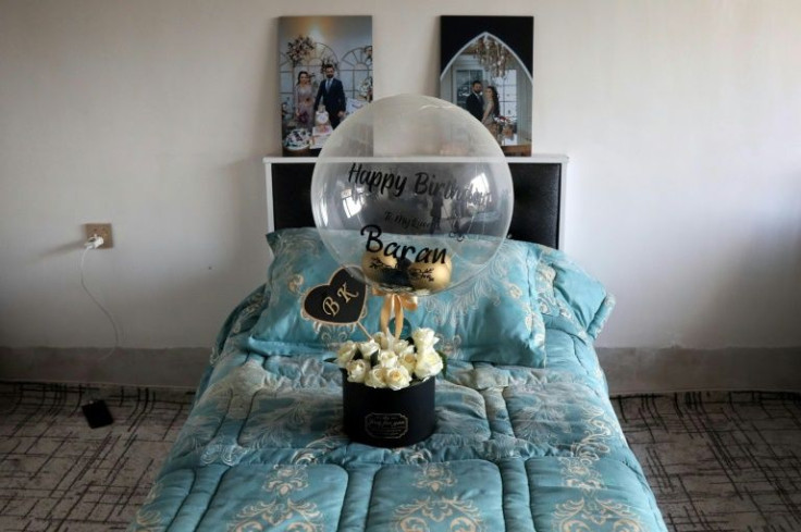Portraits and flowers are placed in the bedroom of Iraqi Kurdish migrant Maryam Nuri Hama Amin, also known as Baran, who was one of at least 27 people who died Wednesday when their inflatable boat sank off the French port of Calais