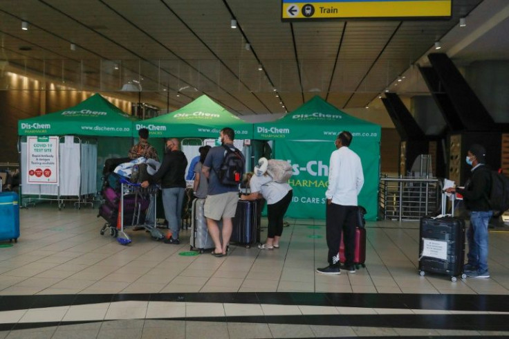 Travellers queue for Covid tests at Johannesburg airport on November 27, 2021, after several countries banned flights from South Africa following the discovery of a new Covid-19 variant
