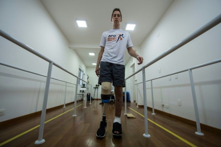 A former goalkeeper of the Brazilian football team Chapecoense, Jakson Follmann, a survivor of an airplane crash in Colombia in 2016 in which most of his teammates perished, walks during a rehabilitation session at a clinic in Sao Paulo, Brazil on Februar