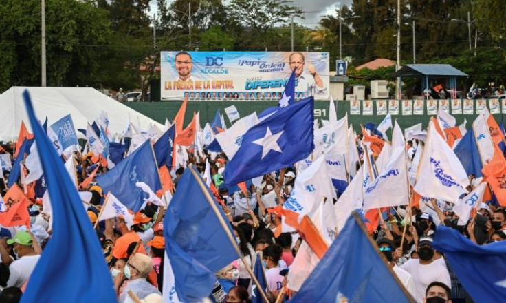 Supporters of Tegucigalpa's mayor and presidential candidate for the ruling National Party Nasry Asfura, aka 'Papi a la Orden' attend the campaign's closing event