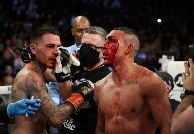 Teofimo Lopez (right) and George Kambosos talk after their championship bout