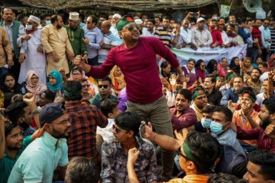 Supporters of the Bangladesh National Party shout slogans protest in Dhaka on November 22, 2021 to demand the government allow the party's ailing leader Khaleda Zia to travel abroad for medical treatment