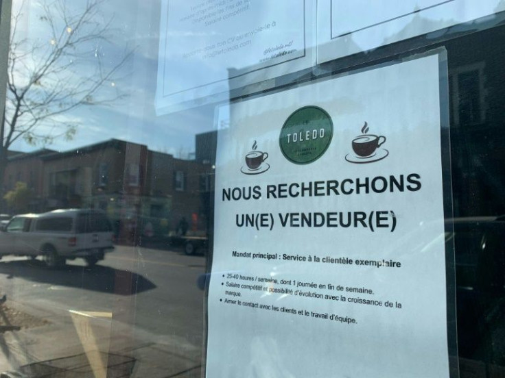 A sign looking for employees is seen on the bakery Le Toledon in Montreal, Quebec on November 11, 2021