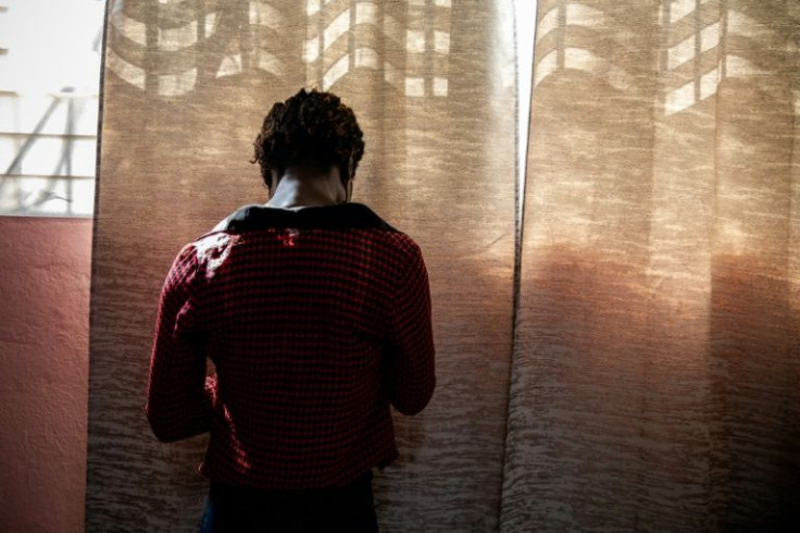 A woman who suffered from sexual violence stands in the MSF clinic in Port-au-Prince