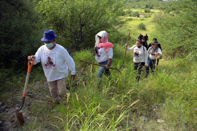 Members of a group of mothers of missing persons search for remains on the outskirts of Hermosillo in northwestern Mexico