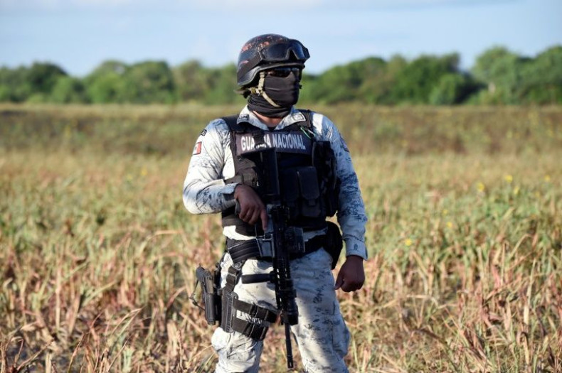 A member of Mexico's National Guard stands watch at La Bartolina in the northeastern state of Tamaulipas