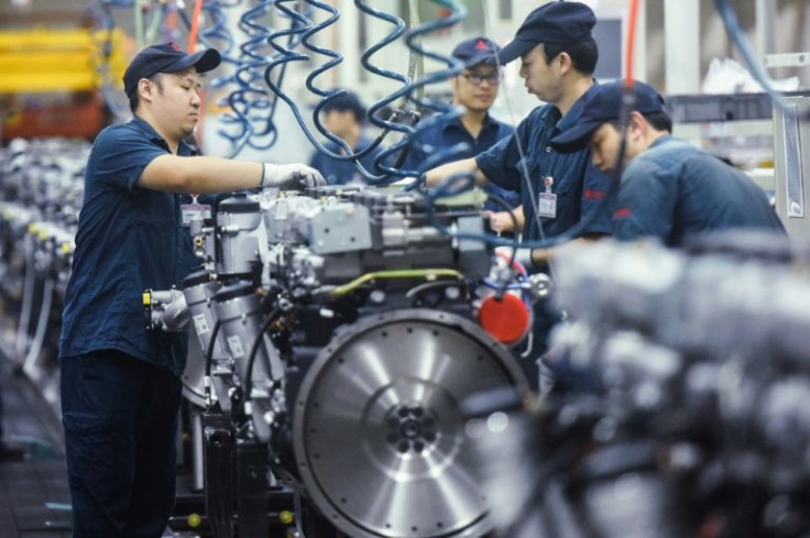 Manufacturing activity in China edged up in November on the back of an easing in power shortages and a drop in some raw material costs, official data showed