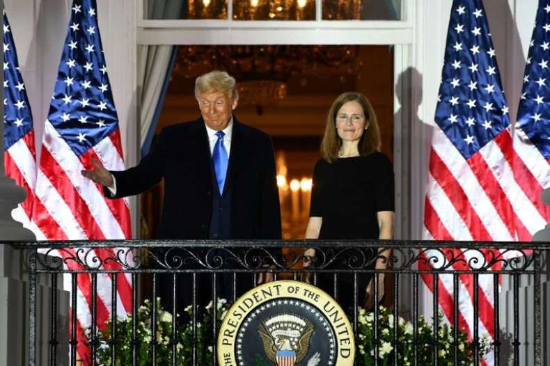US President Donald Trump, pictured with new Supreme Court Justice Amy Coney Barrett in October 2020, is credited with remaking the federal judiciary in the image of his right-wing backers
