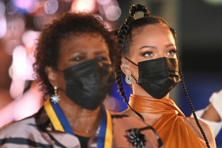Rihanna (with President Sandra Mason, L) was declared a national hero of Barbados minutes after the island became the world's newest republic