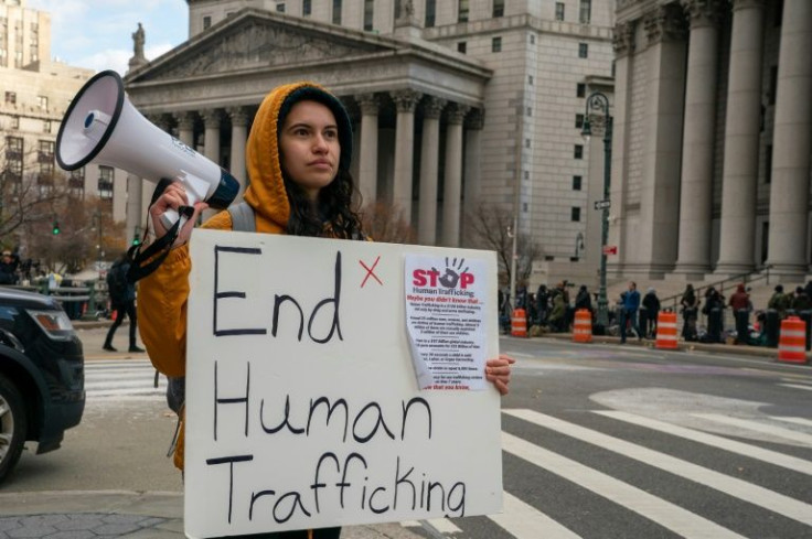 A protestor outside the court where Ghislaine Maxwell is standing trial on sex trafficking charges