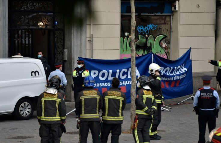 The aftermath of a fire in an abandoned Barcelona building that left four people dead, including a baby and a toddler